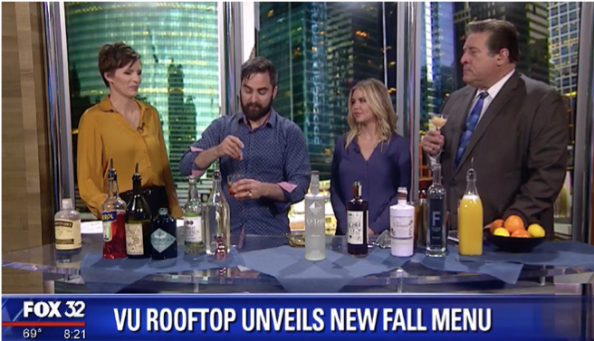 Screenshot from FOX 32 news program with anchors and guests and bottles of various bottles.